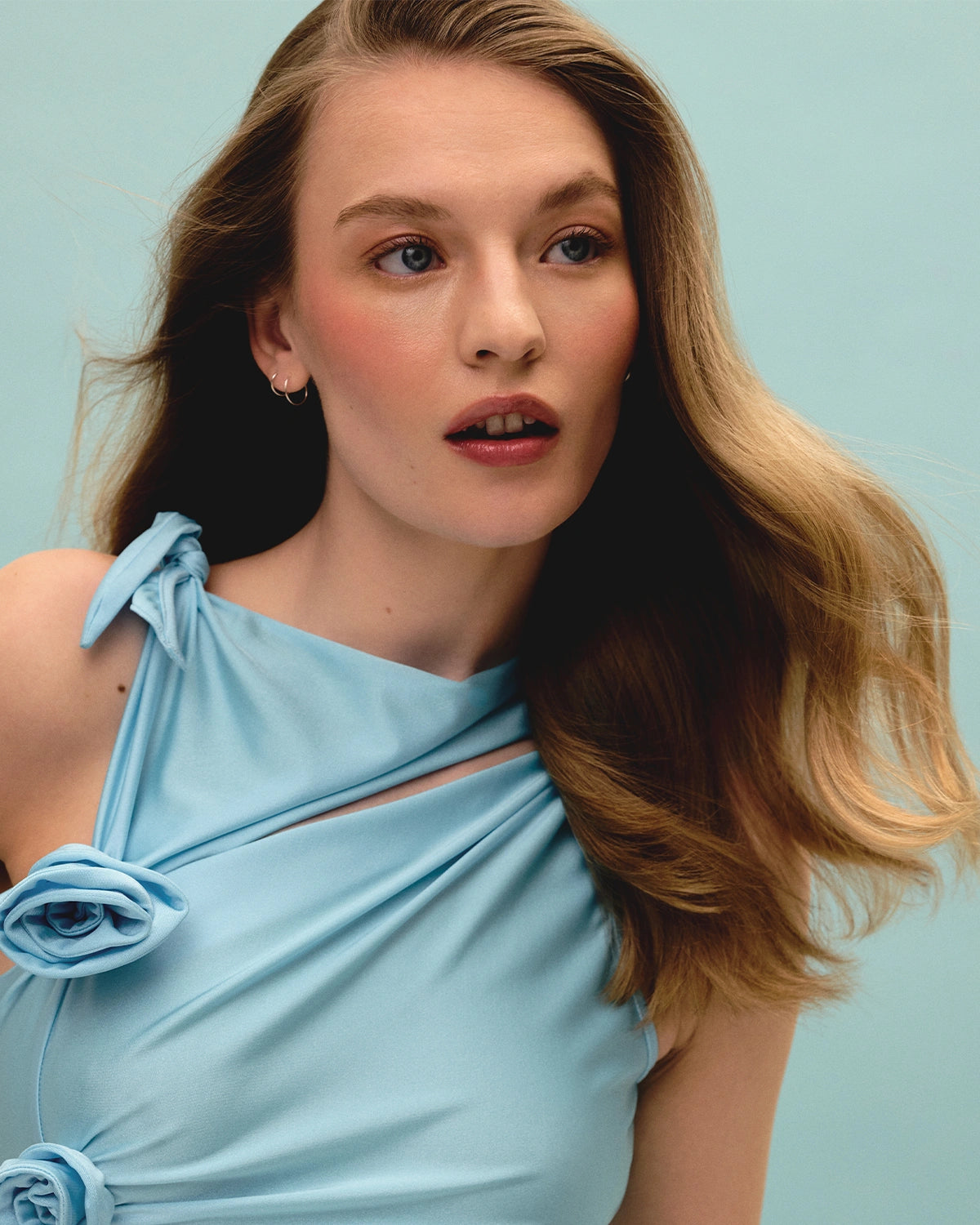 Model using Head & Hair Heal scalp serum for itchy and dry scalp