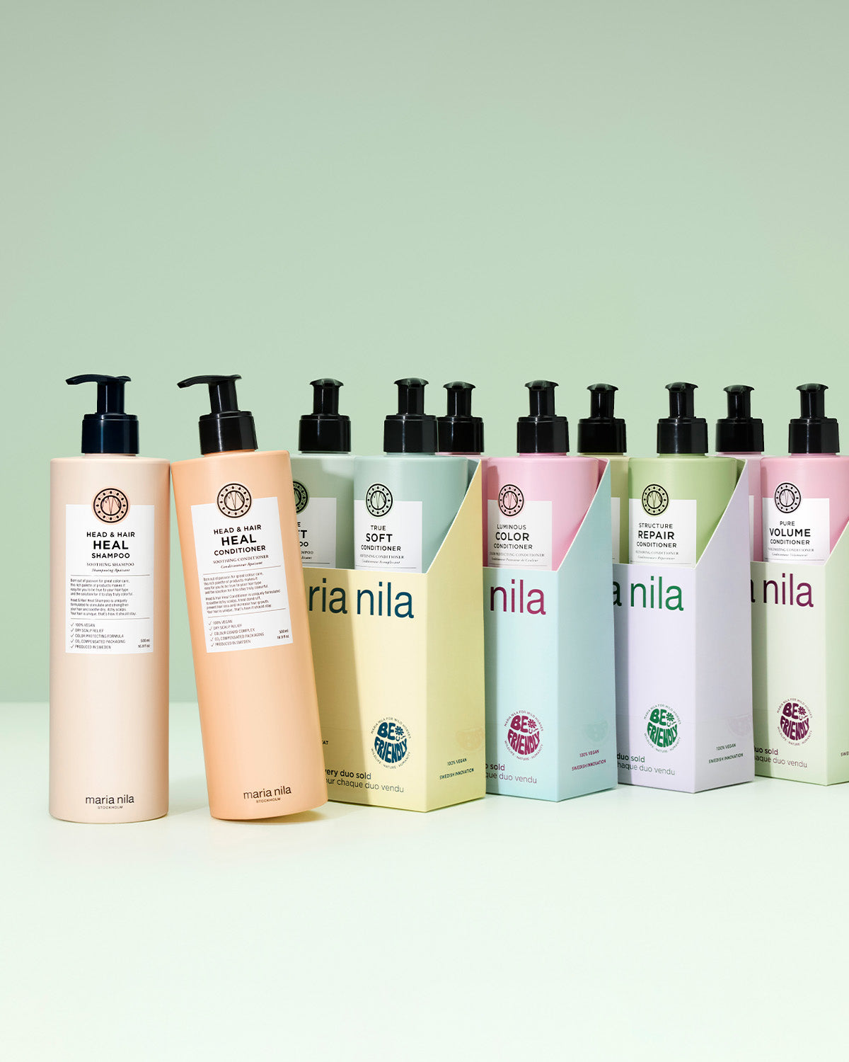 Row of Nila hair care products on a light green background