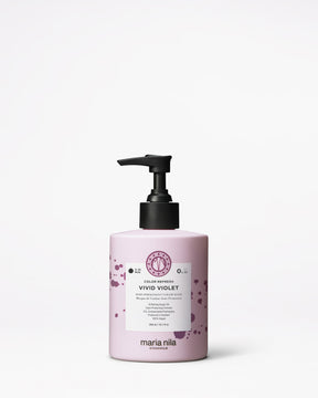 Pink bottle of Maria Nila hair color on a white background
