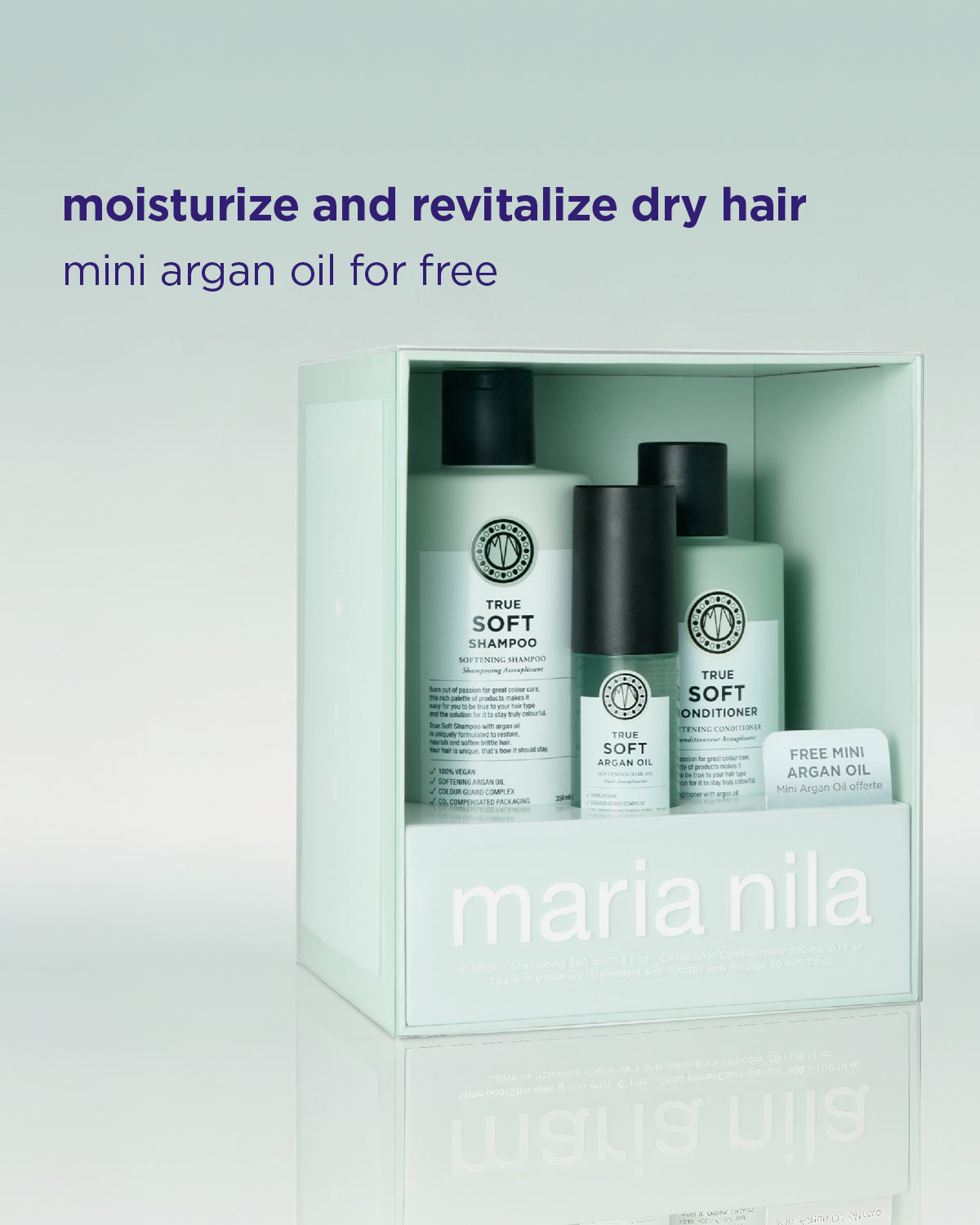 Maria Nila True Soft hair care set in a pale mint green box, featuring shampoo, conditioner, and a small free mini argan oil, with promotional text above on a light gradient background.