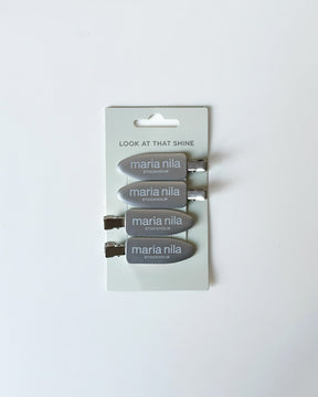 Set of Maria Nila hair clips on a white background