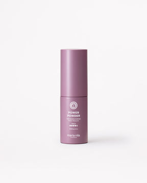 A matte mauve-pink cylindrical cosmetic bottle labeled 'POWER POWDER' and 'maria nila' on a clean white background.